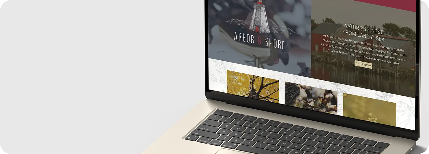 laptop displaying arbor and shore home page