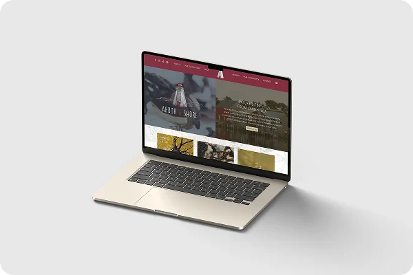 laptop displaying the arbor and shore website